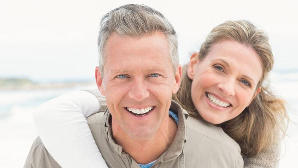 Woman hugging a man.