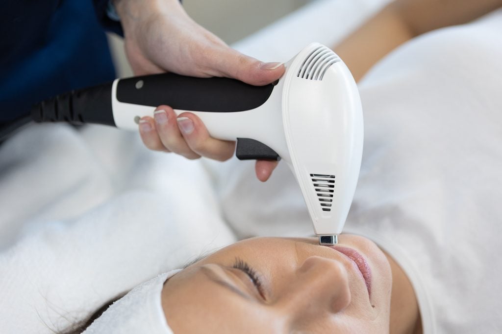 Patient receiving non-surgical skin tightening as part of an aesthetic rejuvenation plan at an Arkadelphia aesthetics practice.